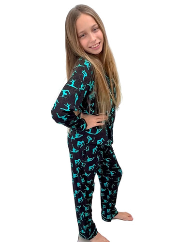 Long sleeve black pyjamas with teal gymnast silhouettes.